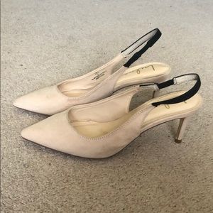 Pale pink heels with black strap